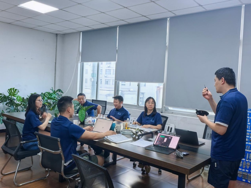 Reaking R&D engineering team meeting in Shengzhou factory discussing industrial lock product development mold design and process improvement
